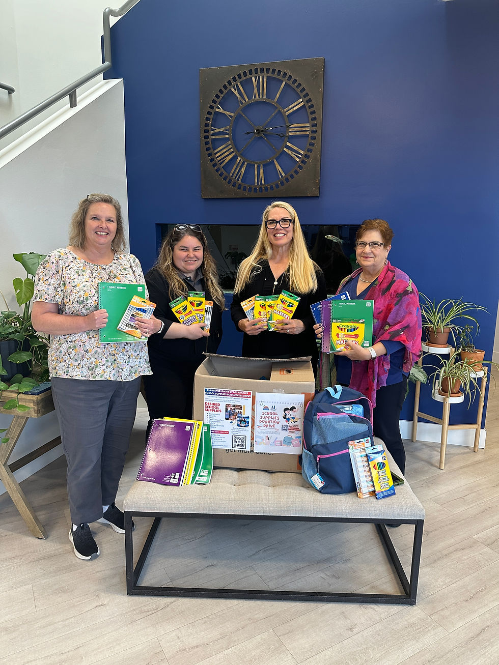 Pacific Advanced Civil Engineering (PACE) Staff with their School Supplies Donation Drive Box