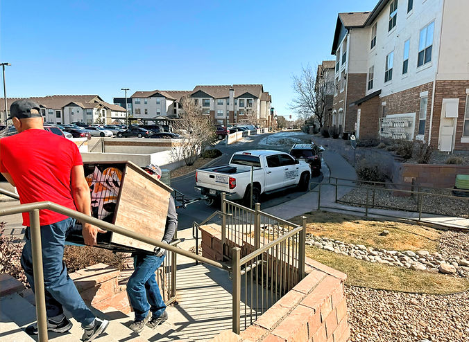 Rocket Services moving helpers loading a customer's rental truck in Colorado