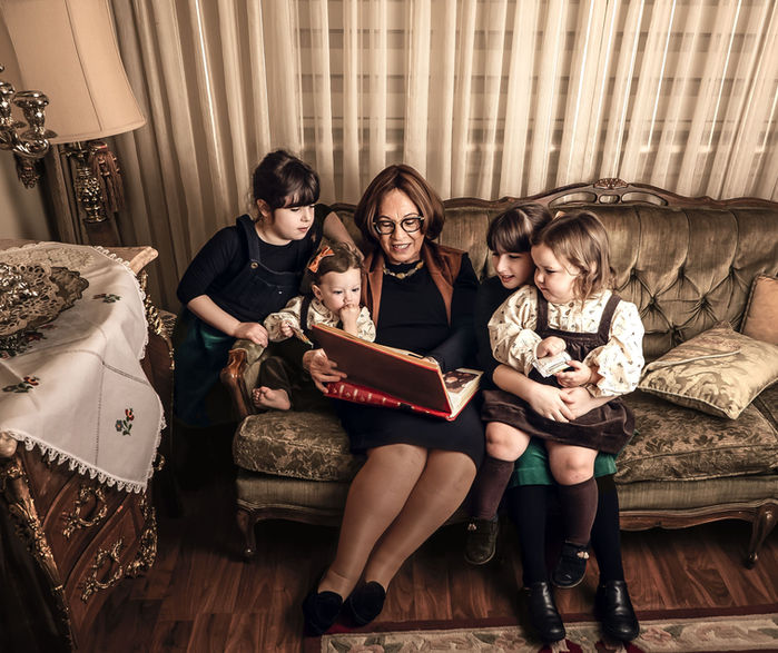 Family of four sitting on a couch during Family Photography Session with Chumie Paneth Photography