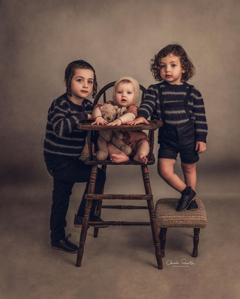 Siblings posing with newborn during Family Photography Session with Chumie Paneth Photography