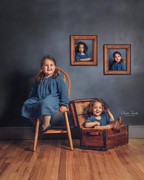 Sisters sitting looking into camera during Children Photography Session with Chumie Paneth Photography