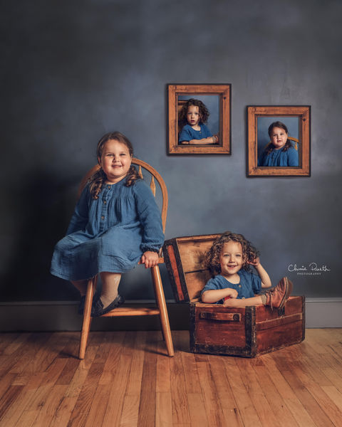 Sisters sitting looking into camera during Children Photography Session with Chumie Paneth Photography