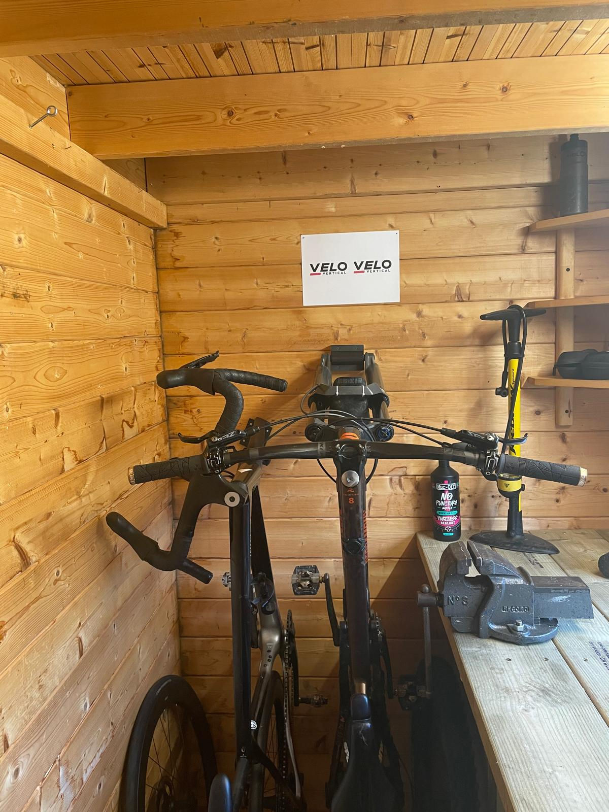 Bolt through vertical bike storage mount