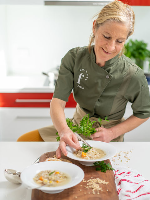 Anita garnishing her dish