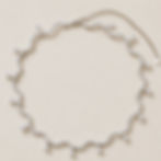Ripple Wave Cubic Zirconia Necklace with sparkling teardrop CZ accents on a soft beige studio background.