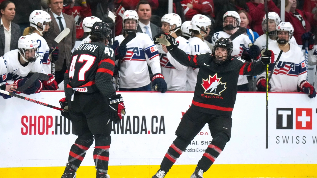 Canada forward Jamie Lee Rattray (47) celebrates with teammate Brianne Jenner (19) after defeating the United States in a shootout of a women’s world hockey championships game in Brampton, Ontario, Monday, April 10, 2023. (Nathan Denette/The Canadian Press via AP)