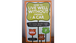 Book cover How to Live Well Without Owning a Car, with bus, bike, and dollar sign icons on orange and green signs.
