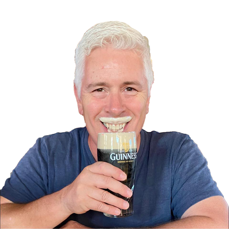J.E. McCarthy Author sipping a Guinness beer