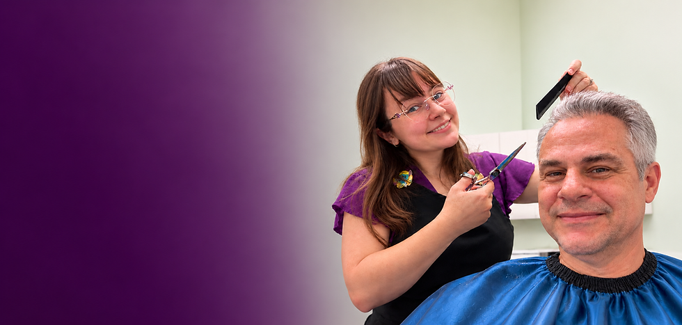 Ashley, owner of Rose Mallow Salon, cutting a client's hair in her Southwest Austin salon suite