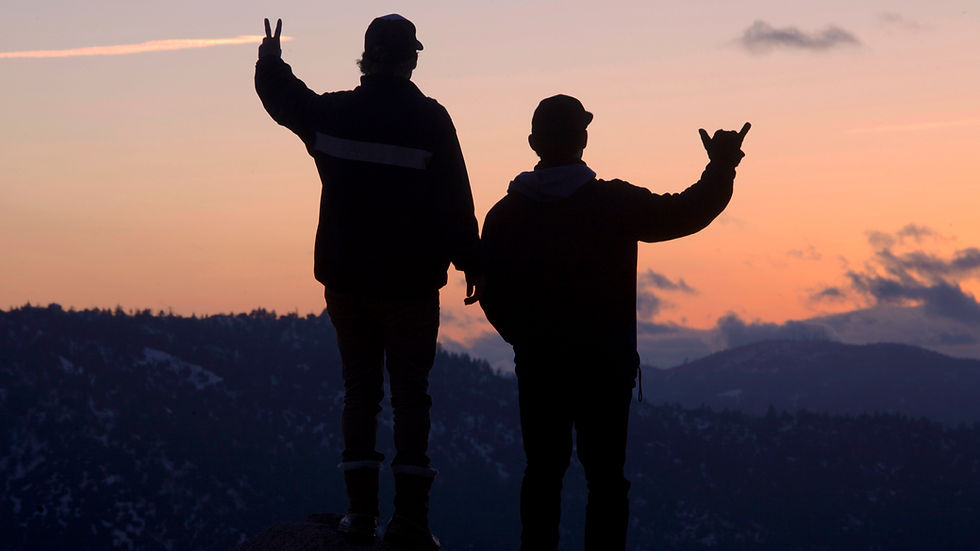 Sunset in Holcomb Valley, Big Bear with mountaineers, highlighting wellness retreats and the spirit of outdoor adventure.