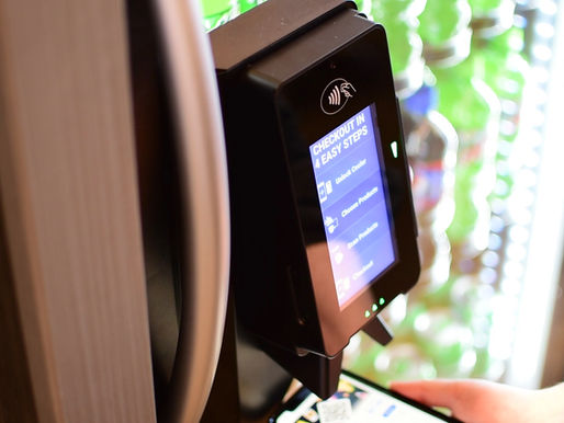 A customer scanning their phone to pay at a Pico Cooler