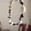 Thumbnail: BLACK AND WHITE STONES NECKLACE