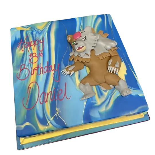 Bespoke Pokemon bear character cake with vibrant colors and detailed icing, crafted in Solihull, West Midlands.