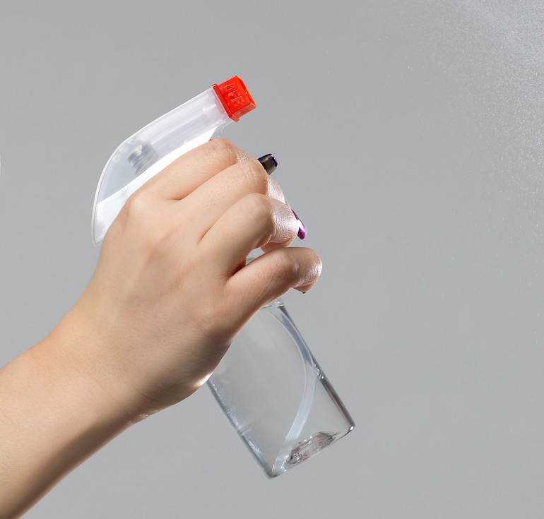 woman-cleaning-room-with-spray.jpg