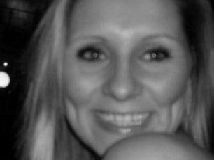 Fiona Moss showing a happy mood. Black and white image with soft lighting | NKMT