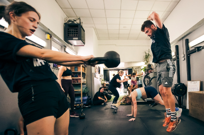 Woman and man training in the gym room | NKMT