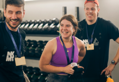 Three people smiling in the gym room | NKMT