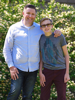 Father and son posing for the camera