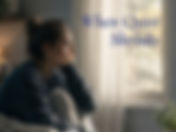 Person sitting quietly on a bed near a window with a blanket and phone nearby, representing the moment rest can begin to feel like emotional hiding.