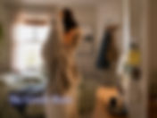 Woman getting ready beside a dresser in a lived-in bedroom, with sticky notes reading “Start smaller than shame” and “This counts,” and the title “The Gentle Reset,” representing self-care without shame.