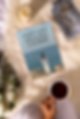 book-mockup-featuring-an-aesthetic-setting-with-coffee-and-a-candle-m26946.png