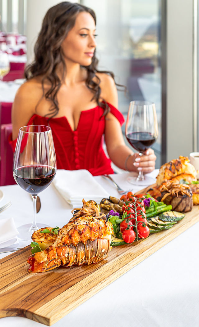 Beautiful girl at Watermark Fallsview Restaurant with surf & turf platter