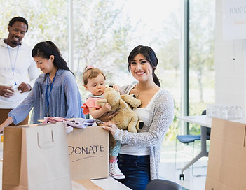 women holding baby collecting donations.jpeg