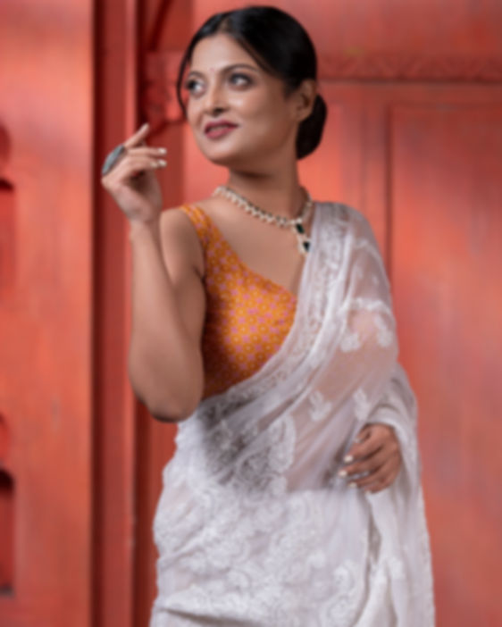 Pure Georgette In White Chikankari Threadwork On A White Background