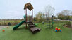 Outdoor playground with slide and climbing structure at New Creations Child Care in Coon Rapids (Riverdale), MN