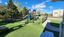 Outdoor playground with play structure, picnic tables and turf at New Creations Child Care in Brooklyn Park, MN