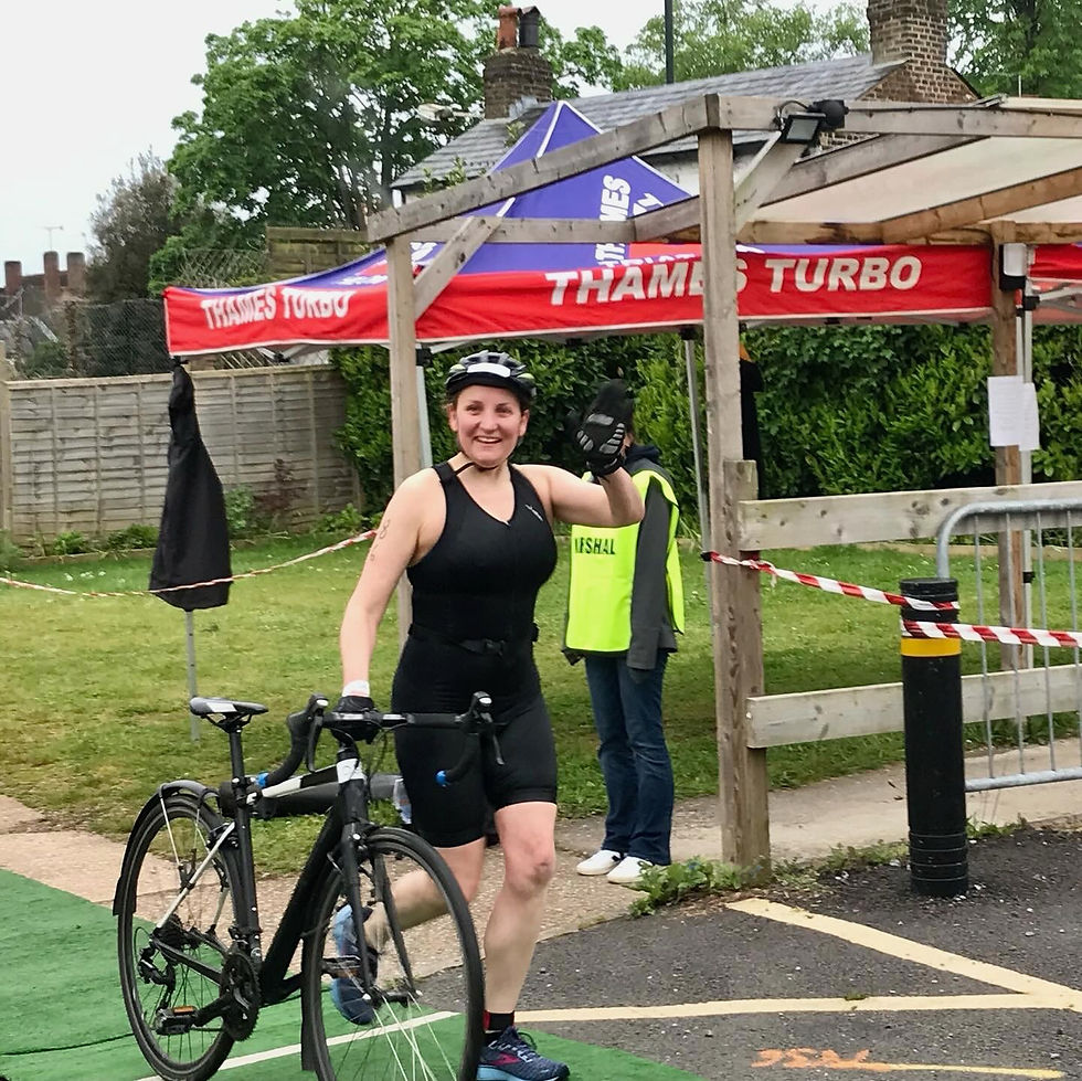 Triathlete running with a bicycle