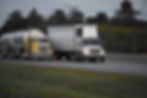 Congested American highway filled with commercial trucks highlighting oversaturation in the trucking industry.