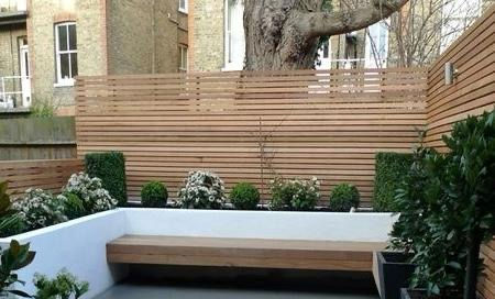 Modern garden renovation Hertfordshire with timber screening and built-in bench – ShellCo Ltd