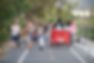 View of the LA River path during a Frogtown Artwalk event with pedestrians and a pedicab with an Awesome Pedicabs sign on the back