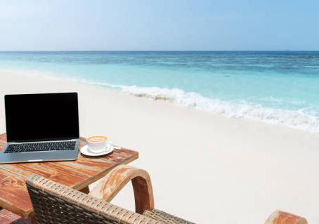 Laptop on the desk at the beach