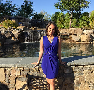 Meagen in front of a waterfall feature