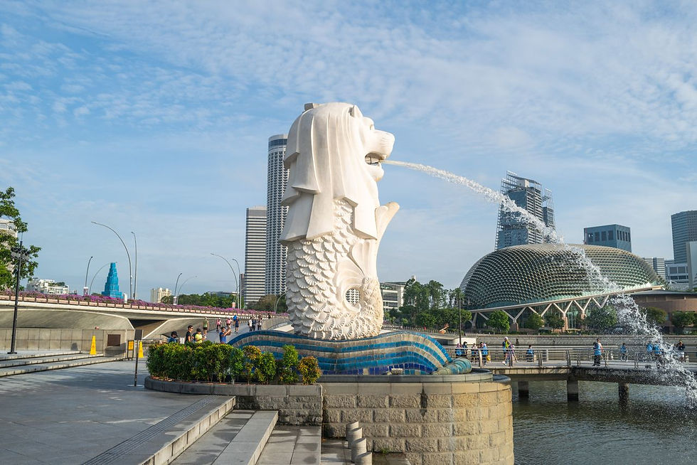 Merlion statue with Singapore skyline backdrop a
