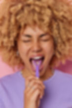 Brush your tongue with a tongue scraper