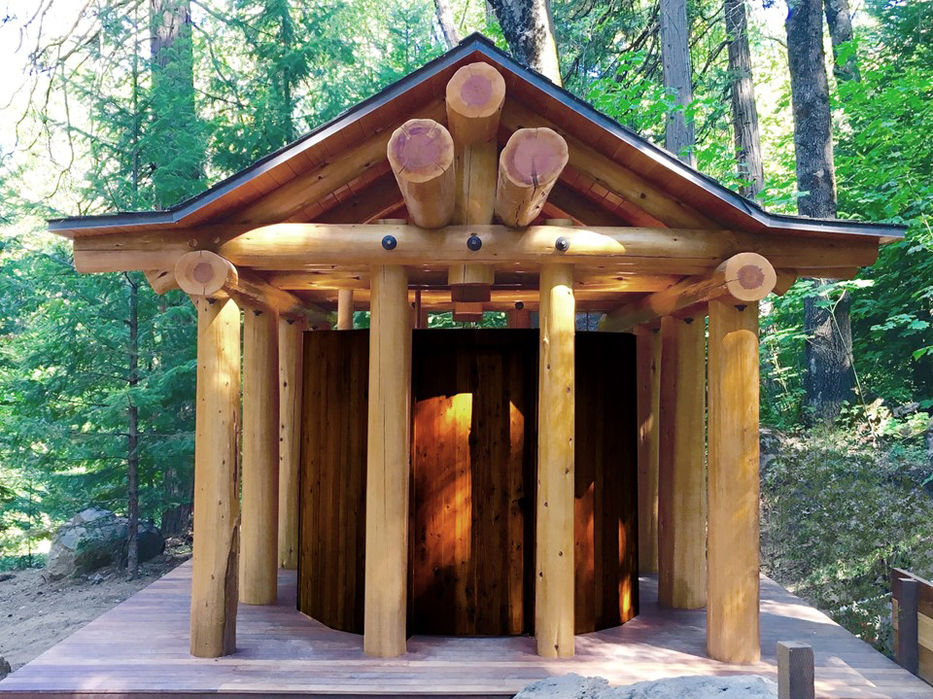 Eight log columns support log entablatures and pediments which were painstakingly scoured and fit together with hidden structural hardware. the project was an intense collaboration of the client, the builders, the engineer, and the architect. every detail, log, and method was discussed at length with the team. the high level of craft resulted from the collaboration and the shared belief that we were building something special in a sacred place.