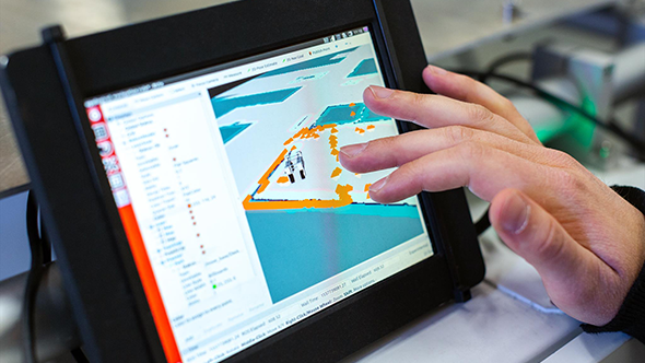 lndividual interacting with training application on tablet screen