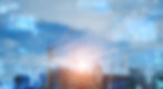 Construction site with cranes against a blue sky, overlaid with digital data graphics. The mood is futuristic and technological.