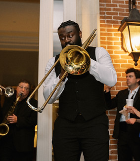 Trumpet player playing during a New Orleans style second line send off at a wedding