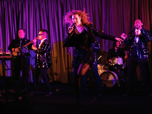 wedding reception band on stage with cool lights