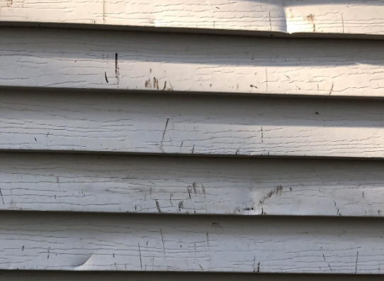 damanged-aluminum-siding.png