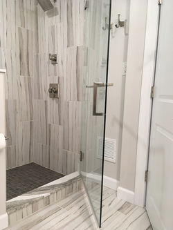 Bathroom shower remodel. Ceramic shower walls and flooring.