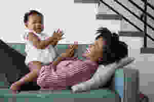 Daughter and Mother clapping hands together.