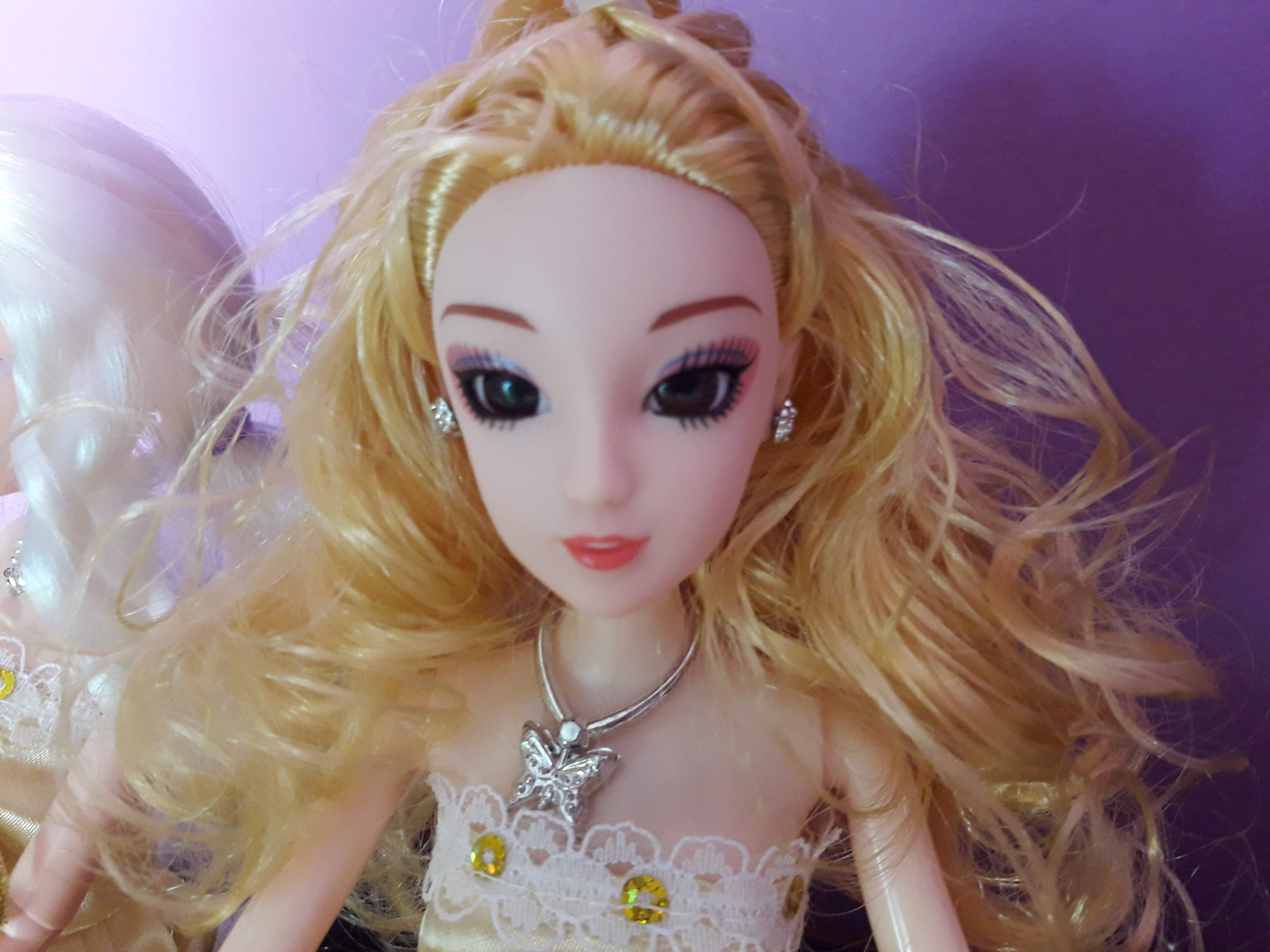 Blond doll with curly hair