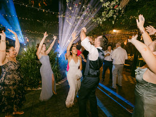 Guests with hands up under moving dance floor lights at an AMP Events and Lighting event in Houston