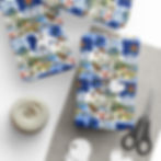 Gift-wrapped presents with Maine-themed wrapping paper, twine, and scissors. Maine gift wrap.
