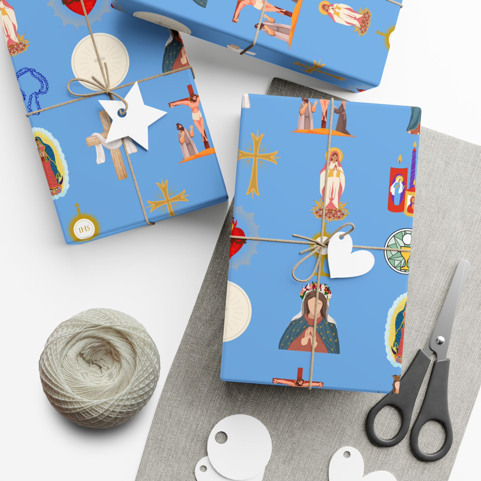 Wrapped gifts with blue Christian Fish Symbol Gift Wrapping Paper | Faith Gifts and scissors